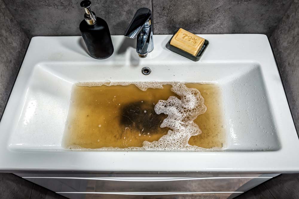 Clogged white sink in bathroom Renton, WA Clogged white sink in bathroom Renton, WA