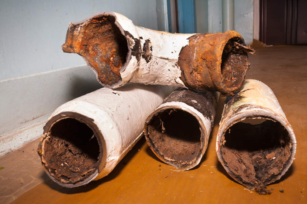 Old, rusty cast iron pipes Old, rusty cast iron pipes