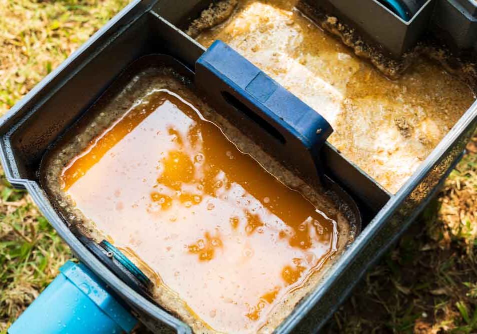 a grease-filled grease trap