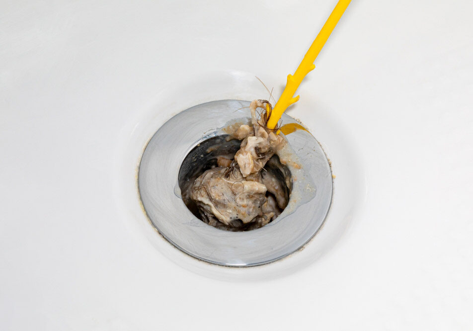 Cleaning hair and soap scum from clogged shower
