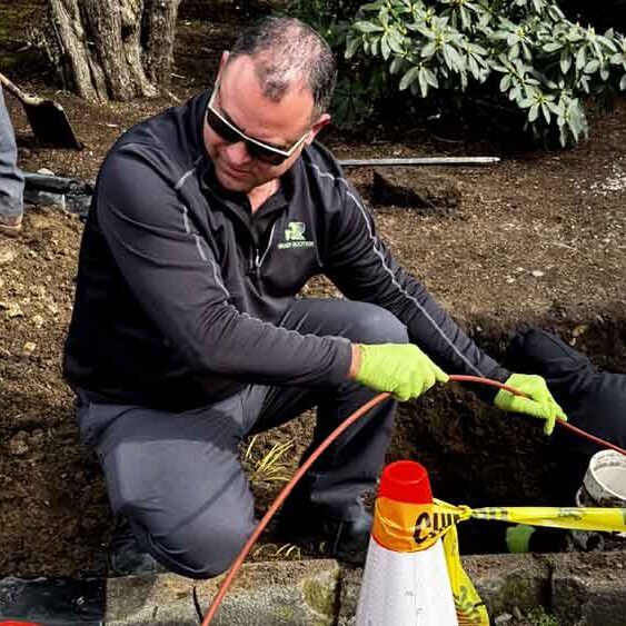 ready-rooter-technician-working-on-sewer-repairs